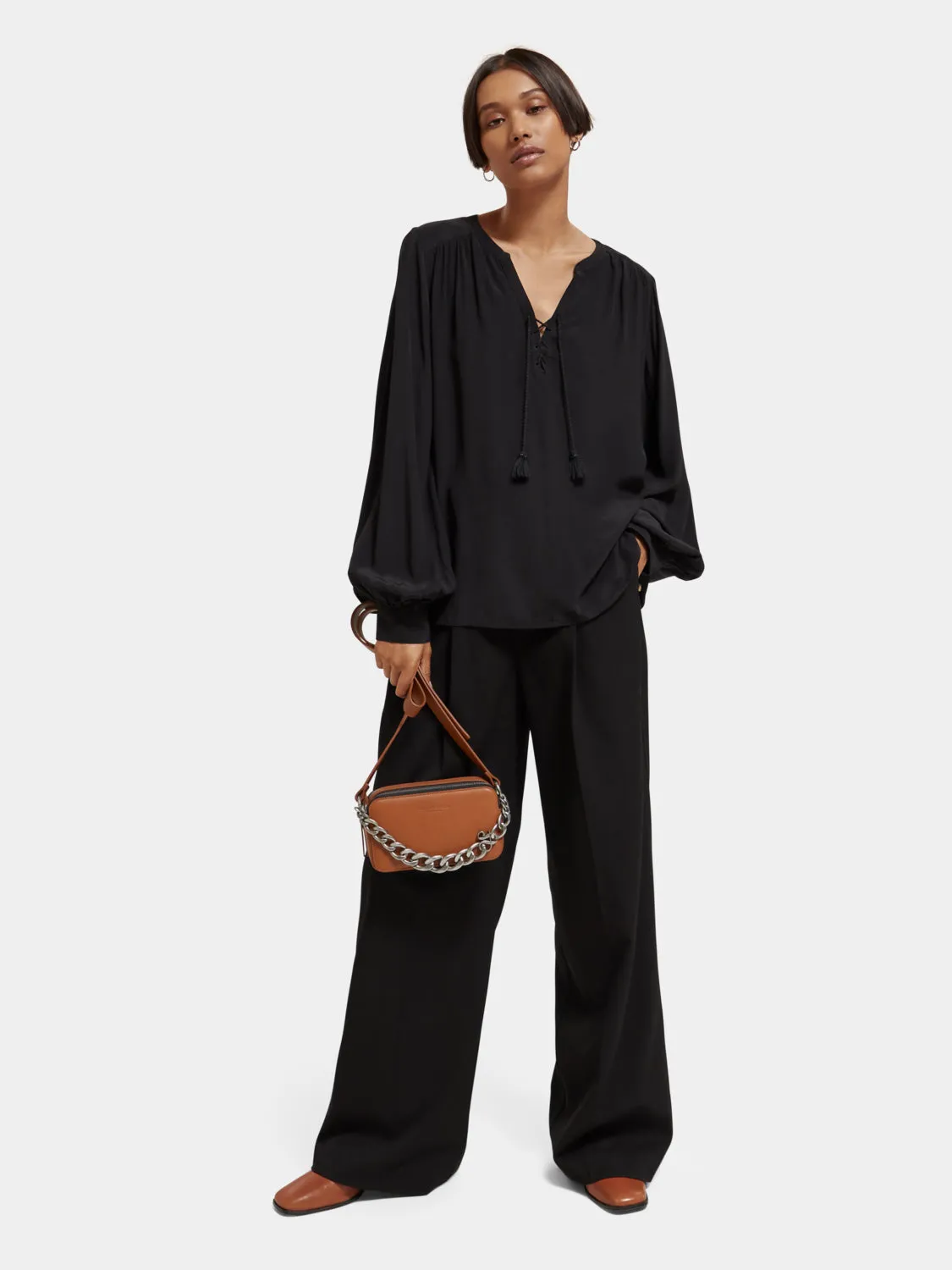Lace-up blouse with balloon sleeves