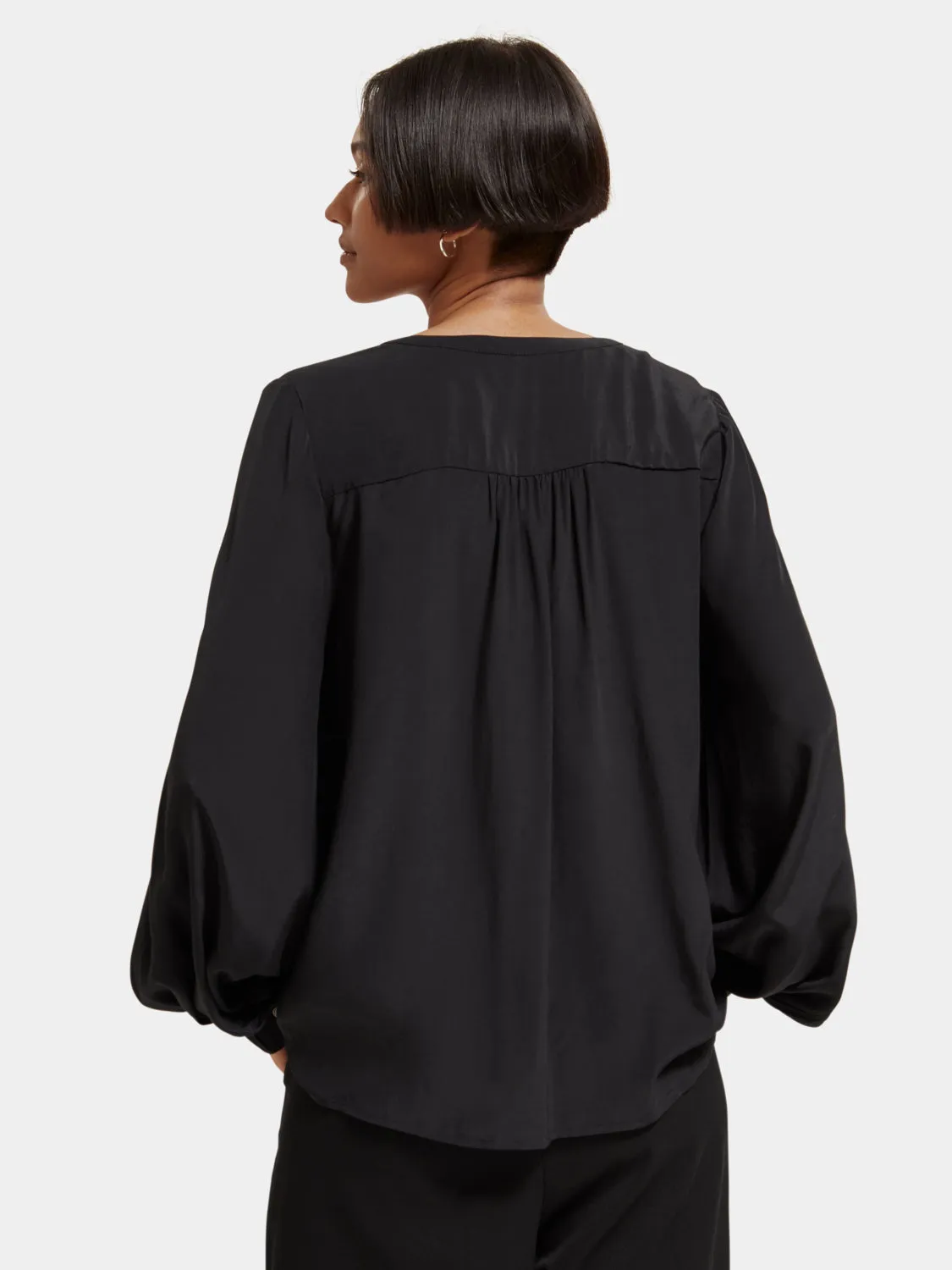 Lace-up blouse with balloon sleeves