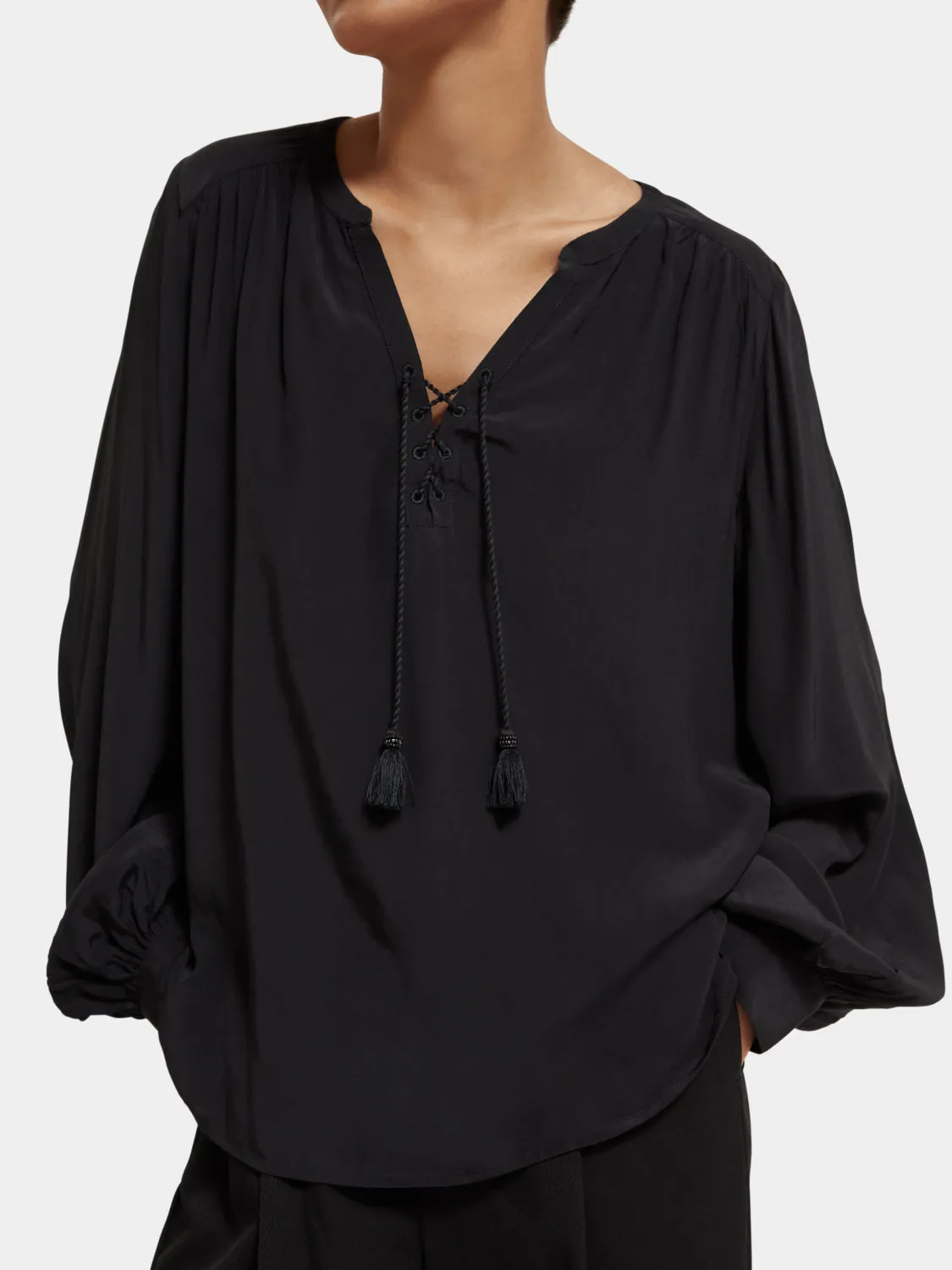 Lace-up blouse with balloon sleeves