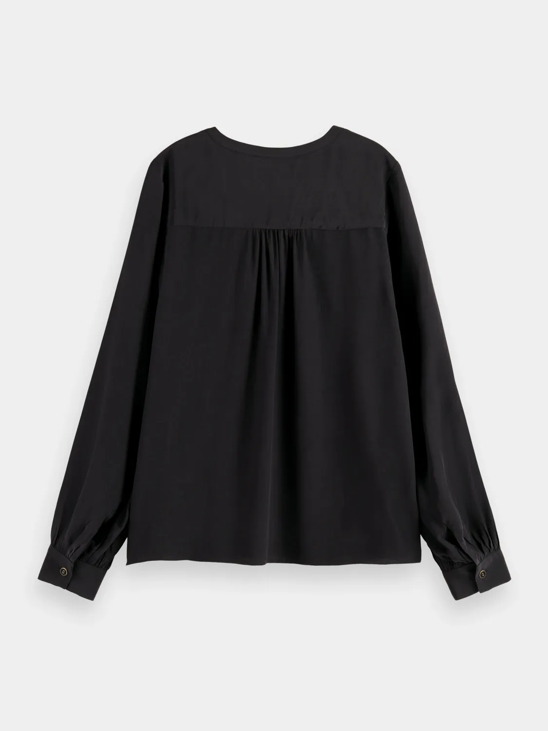 Lace-up blouse with balloon sleeves