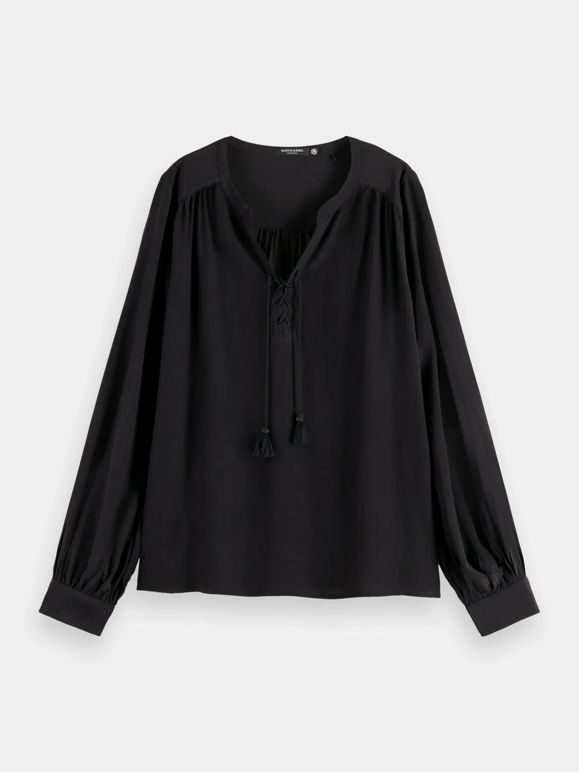 Lace-up blouse with balloon sleeves